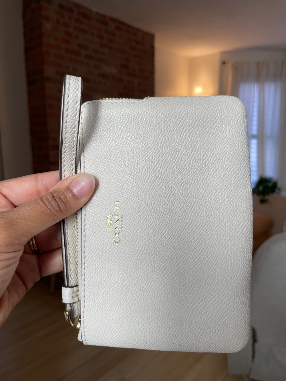 Coach Pebbled Leather Wristlet in Off-White with Gold Logo